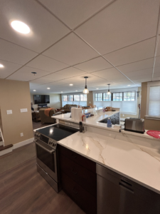 Professional lighting installation in a kitchen and living room by Nuts And Volts Electric LLC in Farmington, NH.