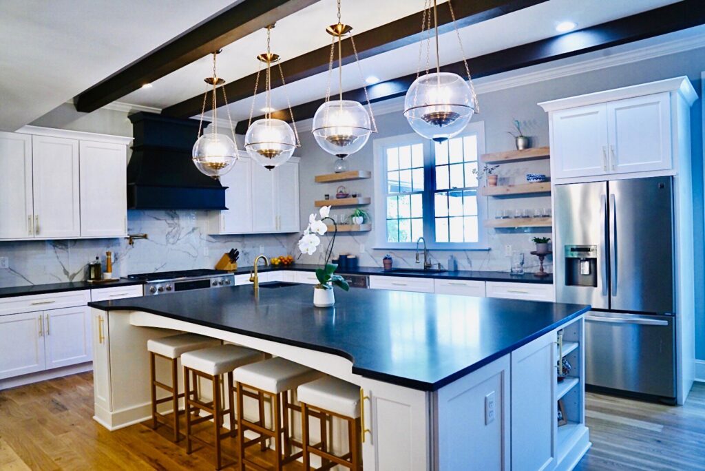 A bright kitchen with stylish pendant lights and under-cabinet lighting, installed by All Connected Electric LLC in Raleigh, NC.