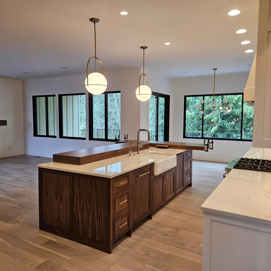 Modern kitchen featuring stylish pendant lights and recessed lighting installed by Jam Electric in Albuquerque, NM.