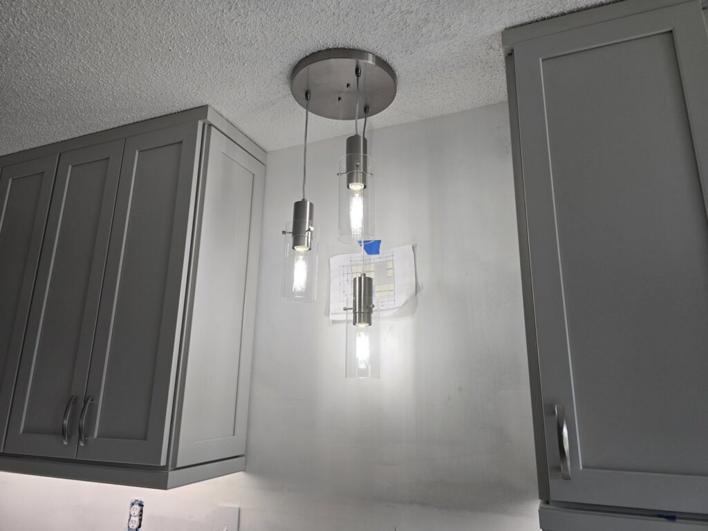Stylish pendant lighting installed above a kitchen counter by Heck Electric, LLC in Everett, WA