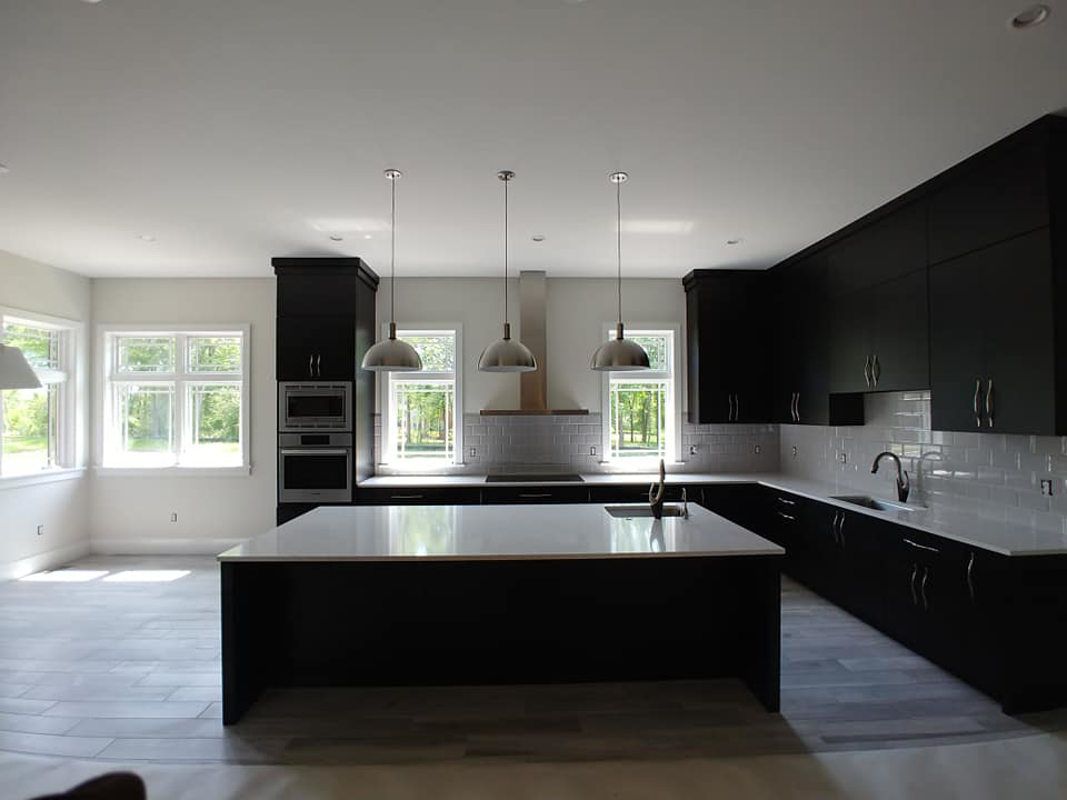Modern kitchen with pendant, recessed, and under-cabinet lighting installed by EFS Electric Inc in Wilmington, DE.