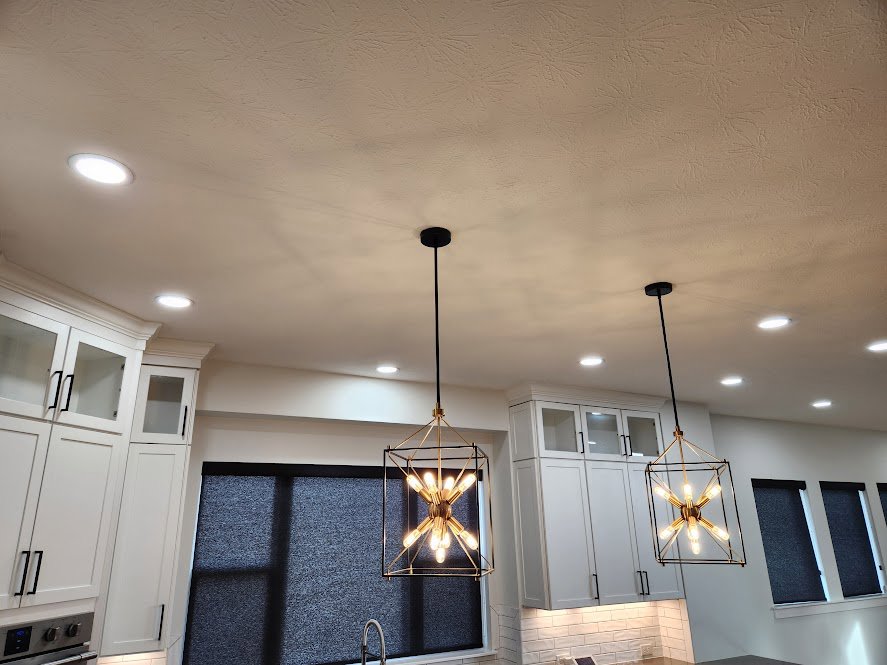 Stylish kitchen with new pendant and recessed lighting fixtures installed by Electrifying Services in Indianapolis, IN