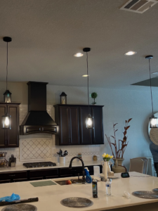 New kitchen pendant and recessed lighting installation by Powered By Voltron in San Antonio, TX.