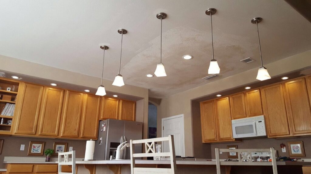 Kitchen featuring stylish pendant lights and recessed lighting installed by Turn It On Electric in Phoenix, AZ