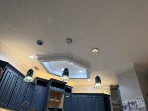 Kitchen with stylish pendant lights and recessed ceiling lighting installed by Heck Electric, LLC in Everett, WA
