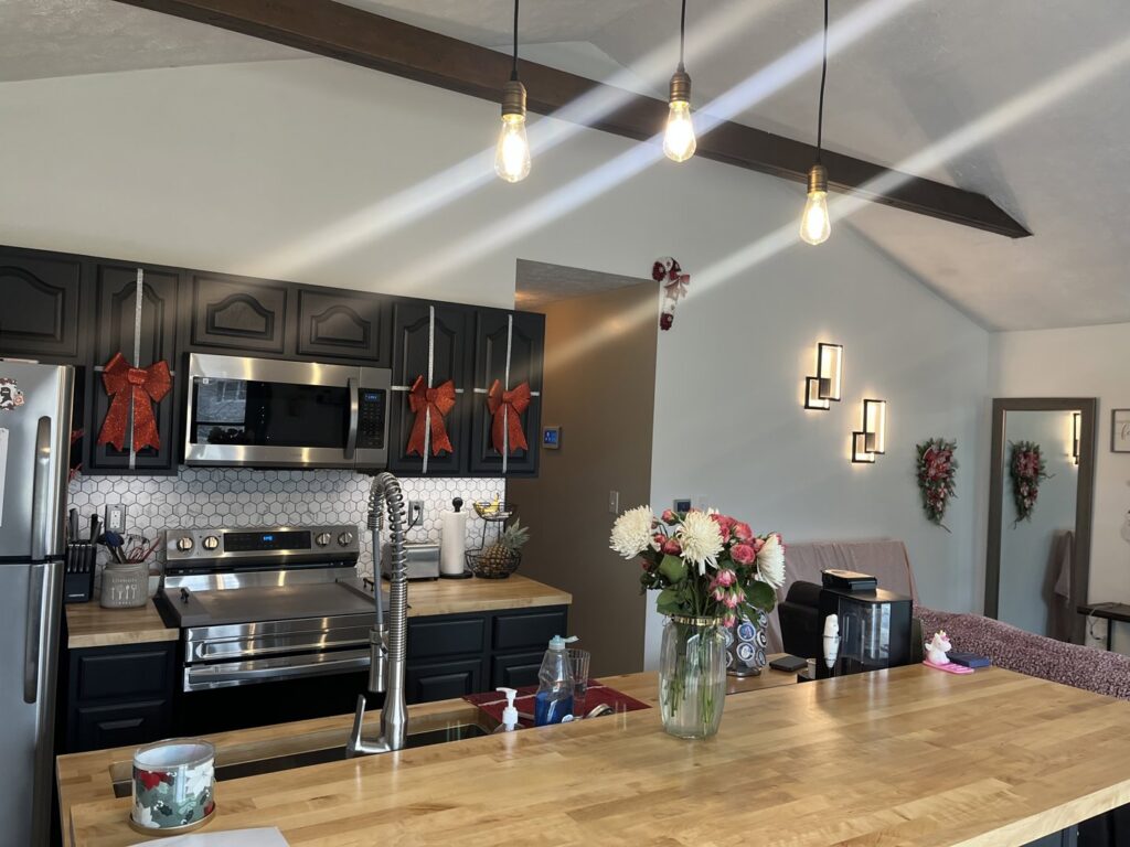 Kitchen with new pendant and wall sconce lighting installed by Ardent Electric in Erie, PA.