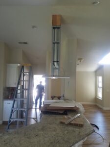 Installation of a kitchen range hood and ductwork, part of HVAC services by All Pro Air in Warrenville, IL.