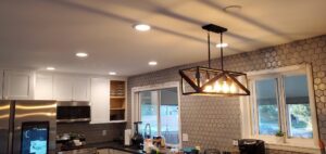 Kitchen with new recessed lighting and a modern pendant fixture installed by Midway Electric Inc. in Columbia, MO.