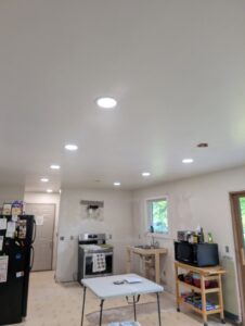 A kitchen under construction with new recessed lighting installed in the ceiling by Apparent Electric LLC in Oshkosh, WI.