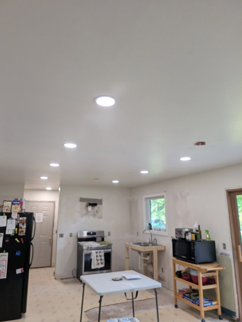 A kitchen under construction with new recessed lighting installed in the ceiling by Apparent Electric LLC in Oshkosh, WI.