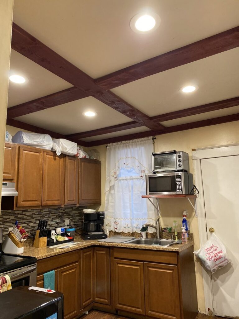 A kitchen with new recessed lighting installed in the ceiling by Omni Electrical Services LLC in Philadelphia, PA.