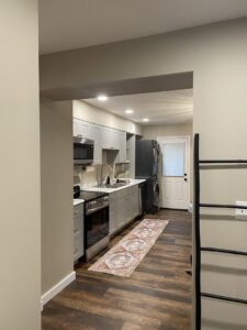 A modern kitchen featuring newly installed recessed lighting by Peak Electric in Mount Washington, KY.