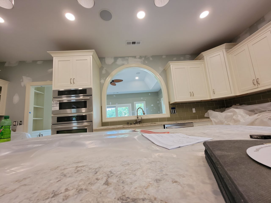Recessed lighting and built-in oven electrical installation in a kitchen under construction by D&R Construction & Electrical Services in Summerville, SC.