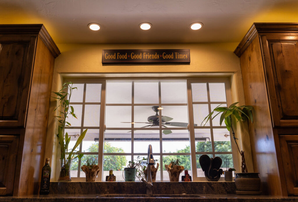 Kitchen with bright recessed lighting installed above a window by Turn It On Electric in Phoenix, AZ