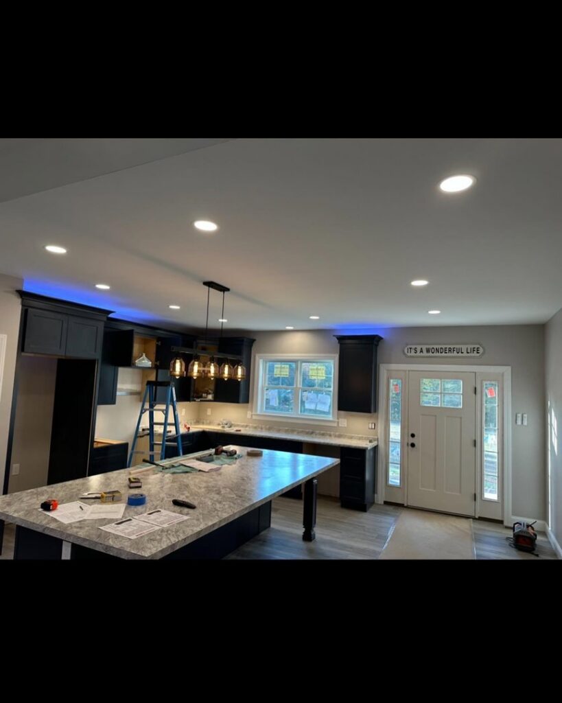 Kitchen with new recessed and pendant lighting installed by Breakers Electric LLC in Dover, NH.