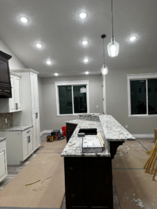 New recessed and pendant lighting installation in a kitchen under construction by High Country Electric in Green River, WY.