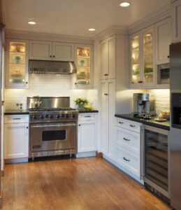 Bright kitchen featuring new recessed and under-cabinet lighting installed by Daigle Electric in Barrington, NH.