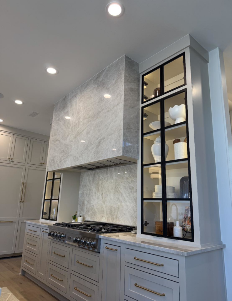 Professional installation of recessed lighting and under-cabinet lights in a modern kitchen by HMH Electric in Fayetteville, AR.