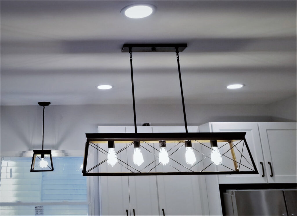 Kitchen featuring a modern rectangular pendant light and recessed lighting installed by Electrifying Services in Indianapolis, IN
