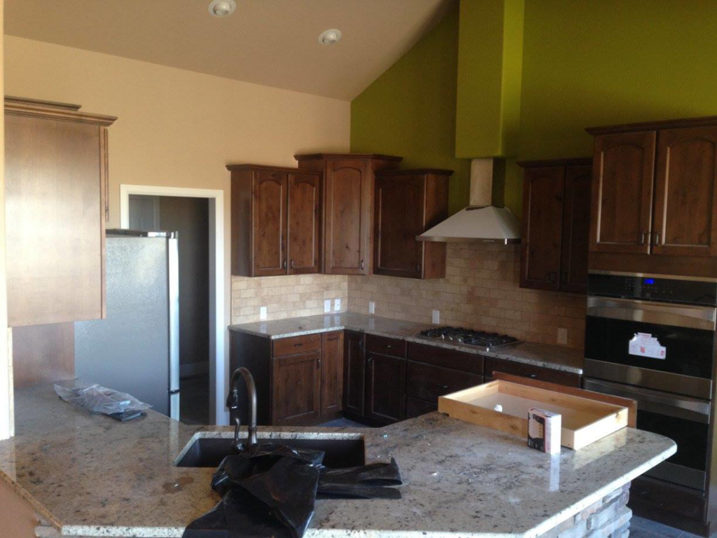 A kitchen remodel showcasing new appliance wiring and recessed lighting installed by Arc-n-Spark Electric in Cheyenne, WY.