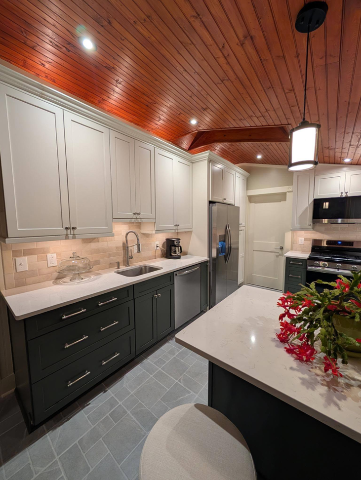 Kitchen sink area with recessed, under-cabinet, and pendant lighting installed by J Turner Electric LLC in Indianapolis, IN.
