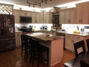 Kitchen with track lighting, under-cabinet lights, and recessed fixtures installed by Electrifying Services in Indianapolis, IN