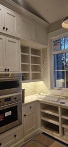Kitchen corner with under-cabinet lighting and built-in appliances installed by Powered Electrical & Lighting Services LLC in Springfield, MO.