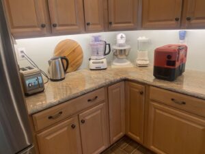 Bright under-cabinet lighting installed in a modern kitchen by Abe Electric LLC in Wallingford, CT.