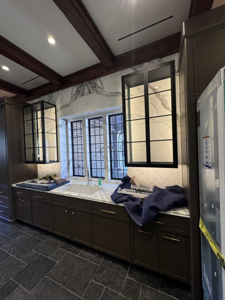 A modern kitchen showcasing under-cabinet and recessed lighting installed by Johnson Electric in Port Angeles, WA.