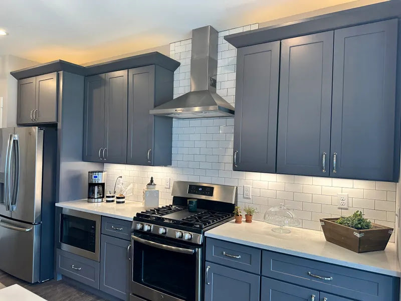 Modern kitchen with new under-cabinet lighting and electrical outlets installed by Daigle Electric in Barrington, NH.