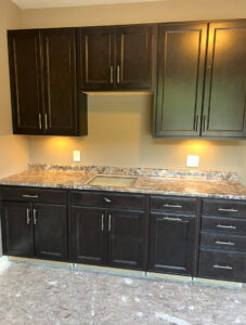 Kitchen cabinets featuring under-cabinet lighting and newly installed electrical outlets by Kouris Electric LLC in Canton, OH.