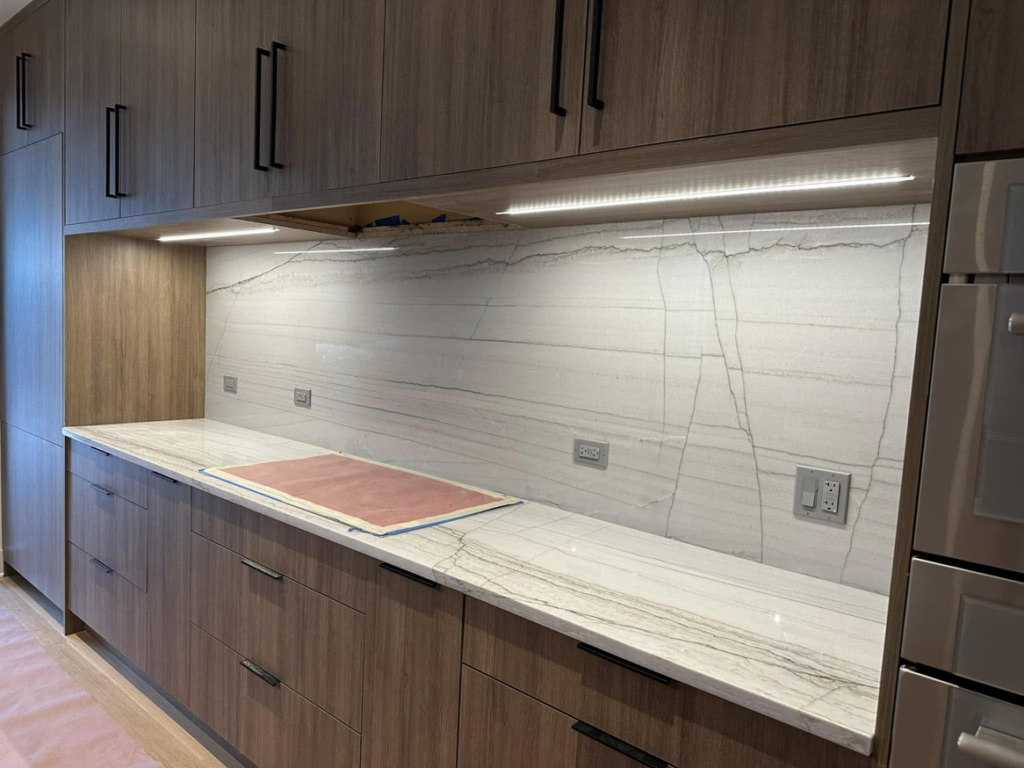Kitchen counter with new under-cabinet lighting and wall outlets installed by Nech Electric Services Inc. in Chicago, IL.
