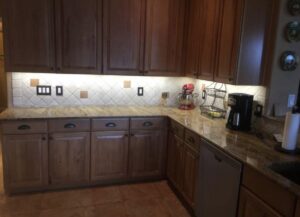 Kitchen under-cabinet lighting installation illuminating the countertop by Ryno Electric in Cape Coral, FL