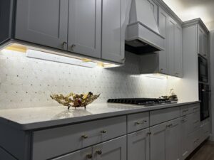 Bright under-cabinet lighting and power strips installed in a modern kitchen by T.E.C Electrical Contracting, LLC in Jacksonville, FL