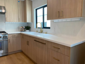 Modern kitchen featuring convenient under-cabinet power strip outlets installed by Kairos Electric and Construction in Anaheim, CA.