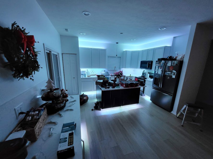 Modern kitchen featuring under-cabinet and recessed ceiling lighting installed by Electrifying Services in Indianapolis, IN