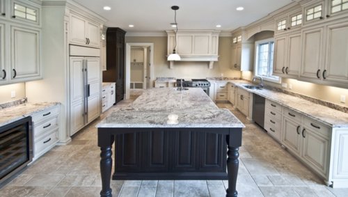 A modern kitchen featuring under-cabinet and recessed lighting installed by Johnson Electric in Port Angeles, WA.