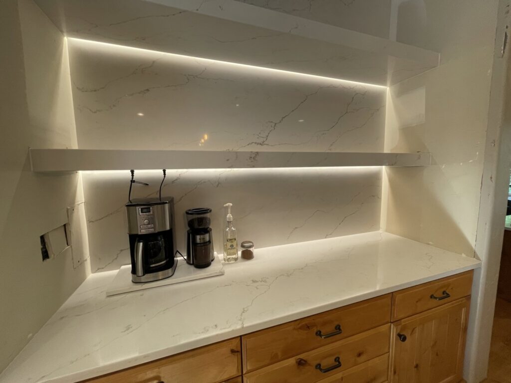 Kitchen coffee bar with under-shelf lighting and visible wiring for electrical work by Volt Electric LLC in Nampa, ID