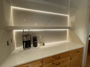 Kitchen coffee bar with under-shelf lighting and visible wiring for electrical work by Volt Electric LLC in Nampa, ID