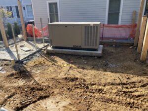 A Kohler generator being installed on a concrete pad by Boyland Electric Inc. in Laytonsville, MD.