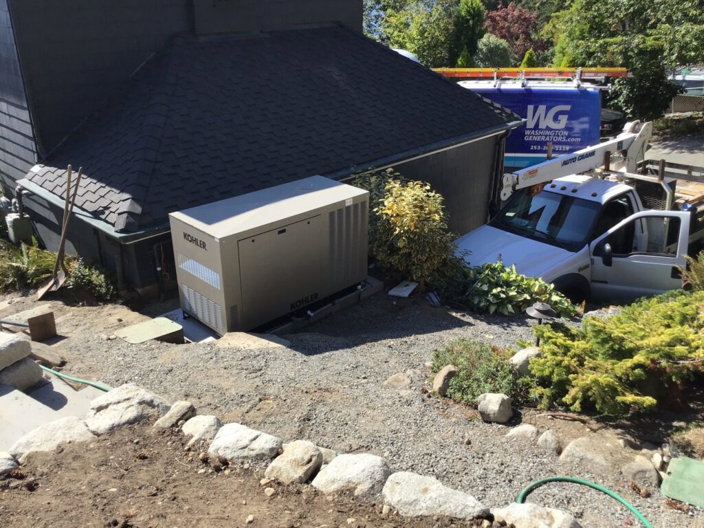 A Kohler generator installation with a Washington Generators LLC truck visible in Kent, WA.