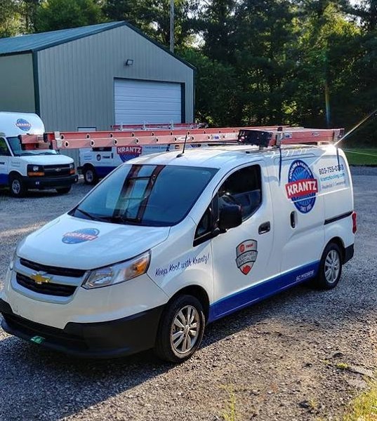 A Krantz Kooling & Heating service van parked outside a commercial building in West Columbia, SC, ready for service