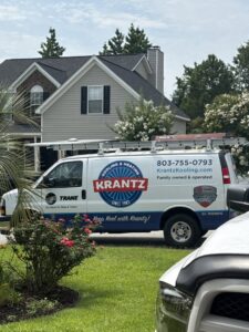 A Krantz Kooling & Heating service van parked outside a residential home in West Columbia, SC, ready for a job