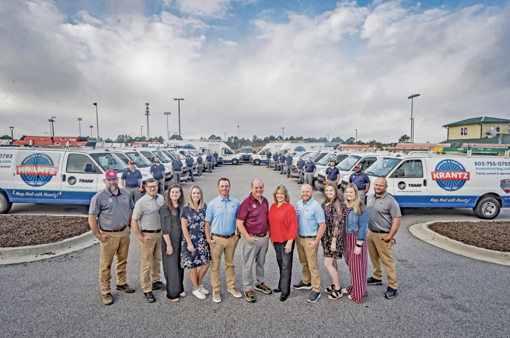 The Krantz Kooling & Heating team stands proudly in front of their service vehicle fleet in West Columbia, SC