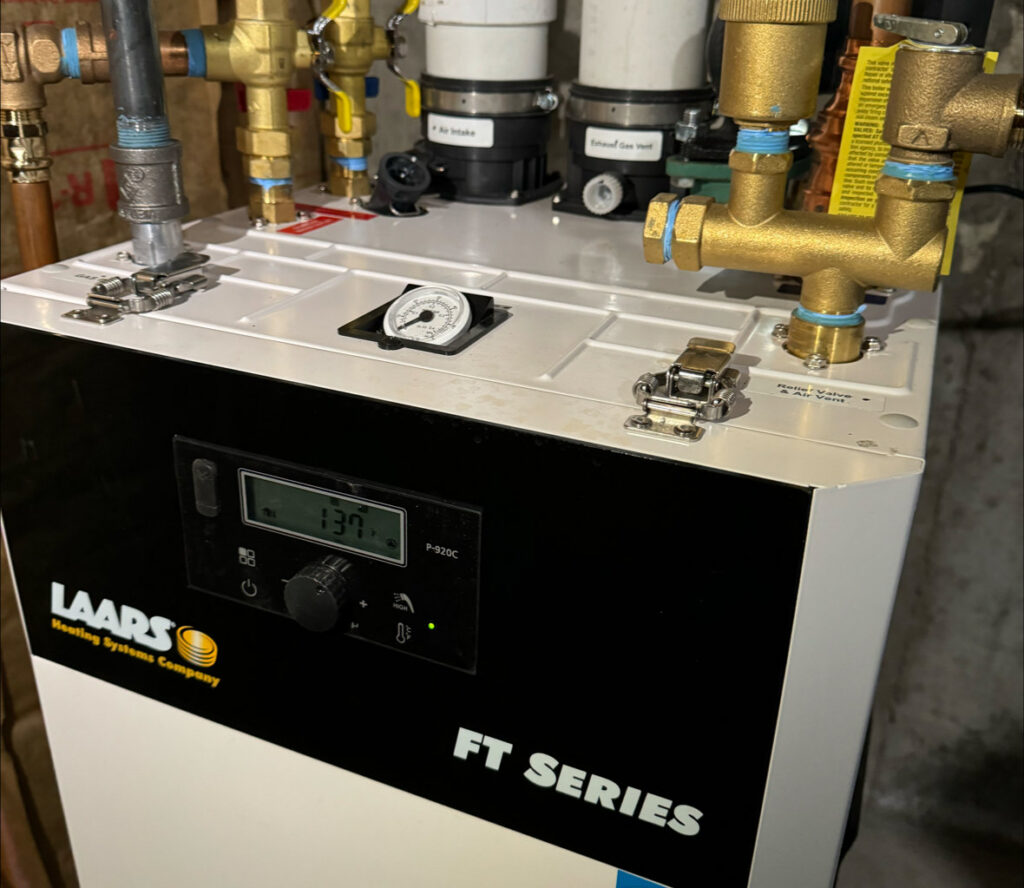 A close-up of a LAARS FT Series boiler control panel by Comfort Systems and Solutions in Coventry, RI