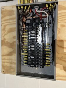 A neatly wired and labeled electrical breaker panel installed by Ardent Electric in Erie, PA.