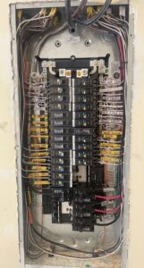 An open electrical panel with labeled circuit breakers and wiring by G5 Electric LLC in Phoenix, AZ
