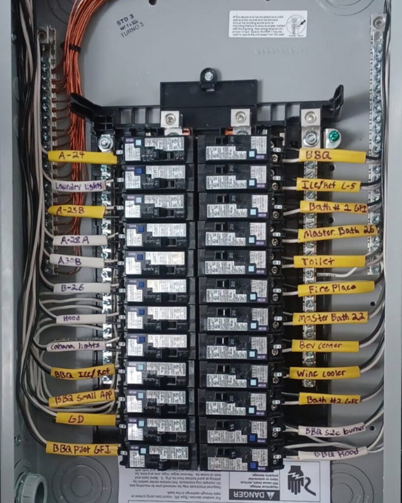 A neatly wired and labeled residential electrical panel with circuit breakers installed by Krakkom Electric in Sunrise, FL.