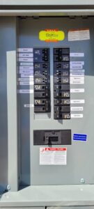 A clearly labeled residential electrical panel, indicating professional service from Smith Electrical Contractors, Inc. in El Cajon, CA.