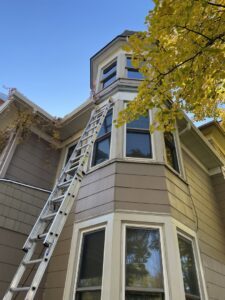 A ladder leaning against a house exterior, indicating wildlife inspection or exclusion work by Prairie Bat Services, LLC in Sioux Falls, SD.